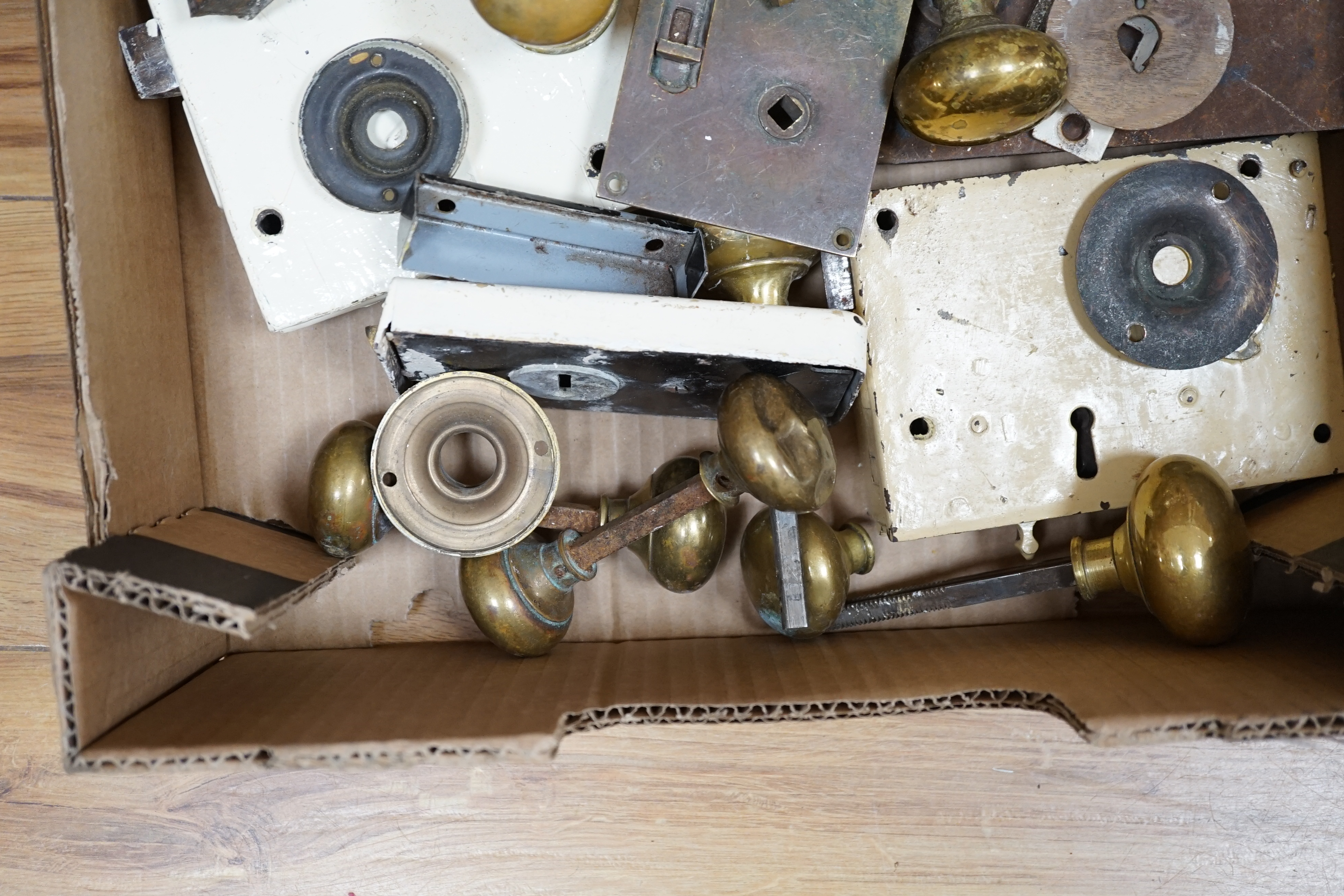 A collection of door locks and brass knobs